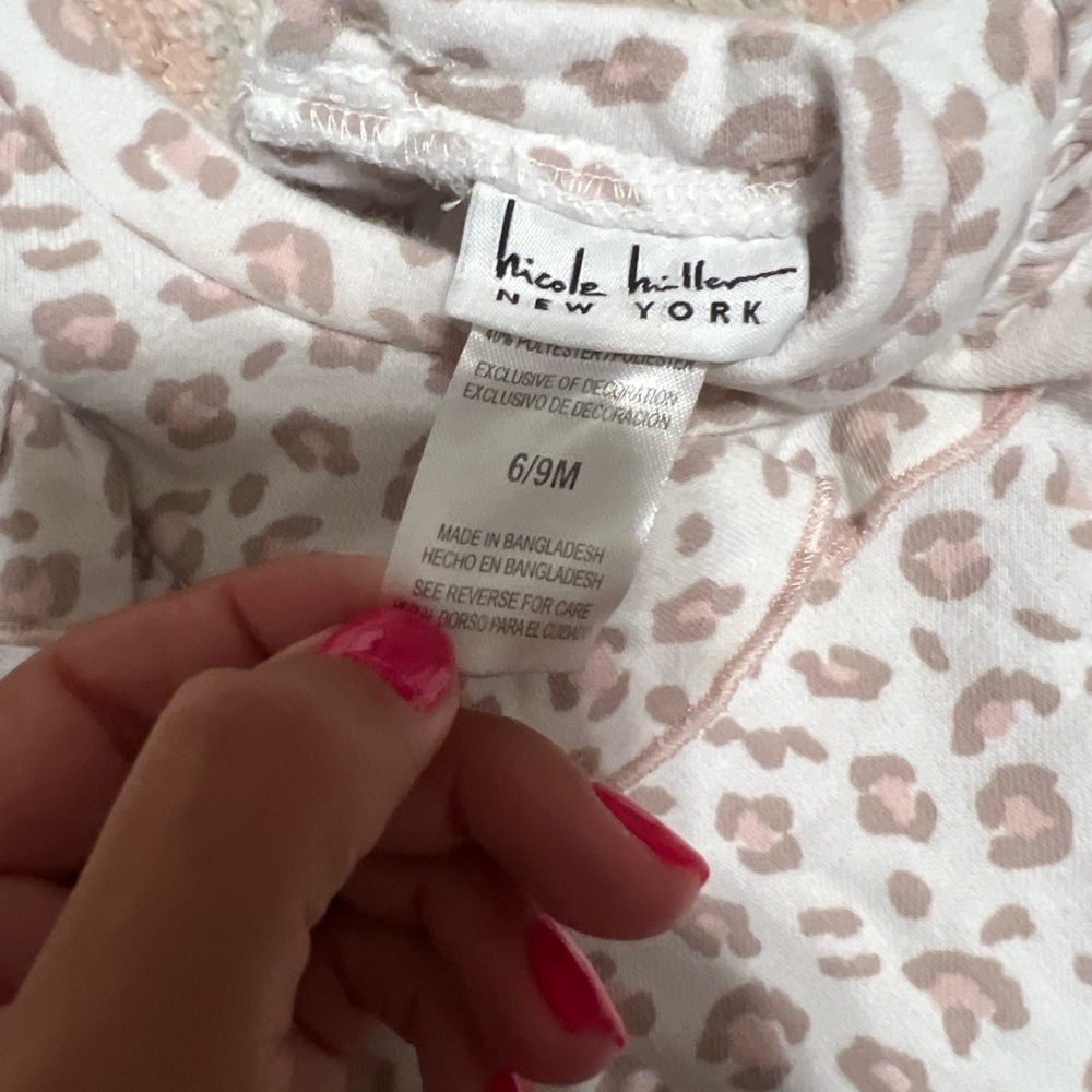 6-9 months. Nicole miller brand. Long sleeve cheetah print sweater.